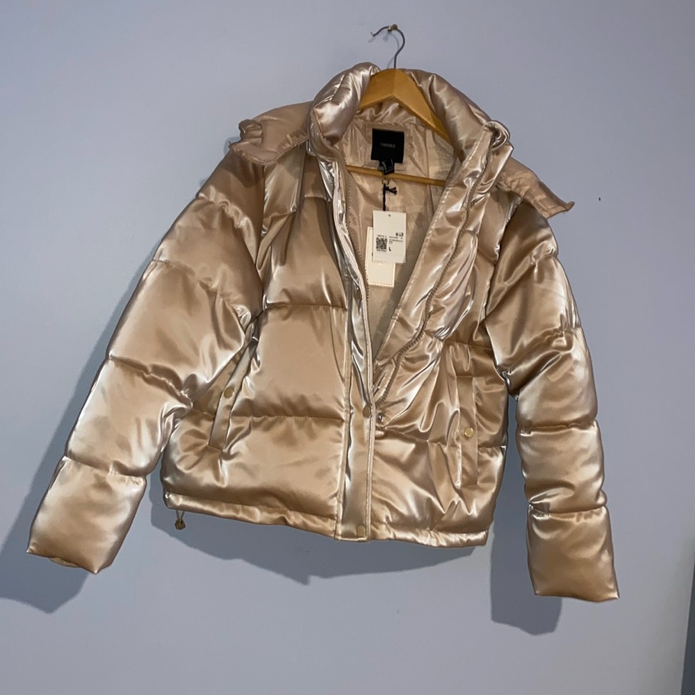 Champagne puffer jacket, size large. Drawstring waist, hooded. NWT